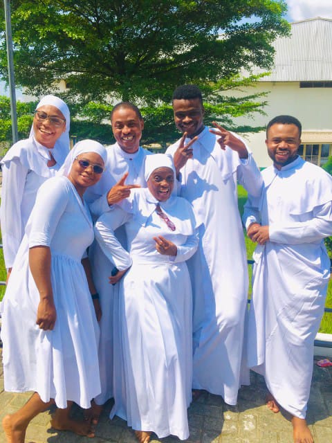 Caregivers and young people smiling together
