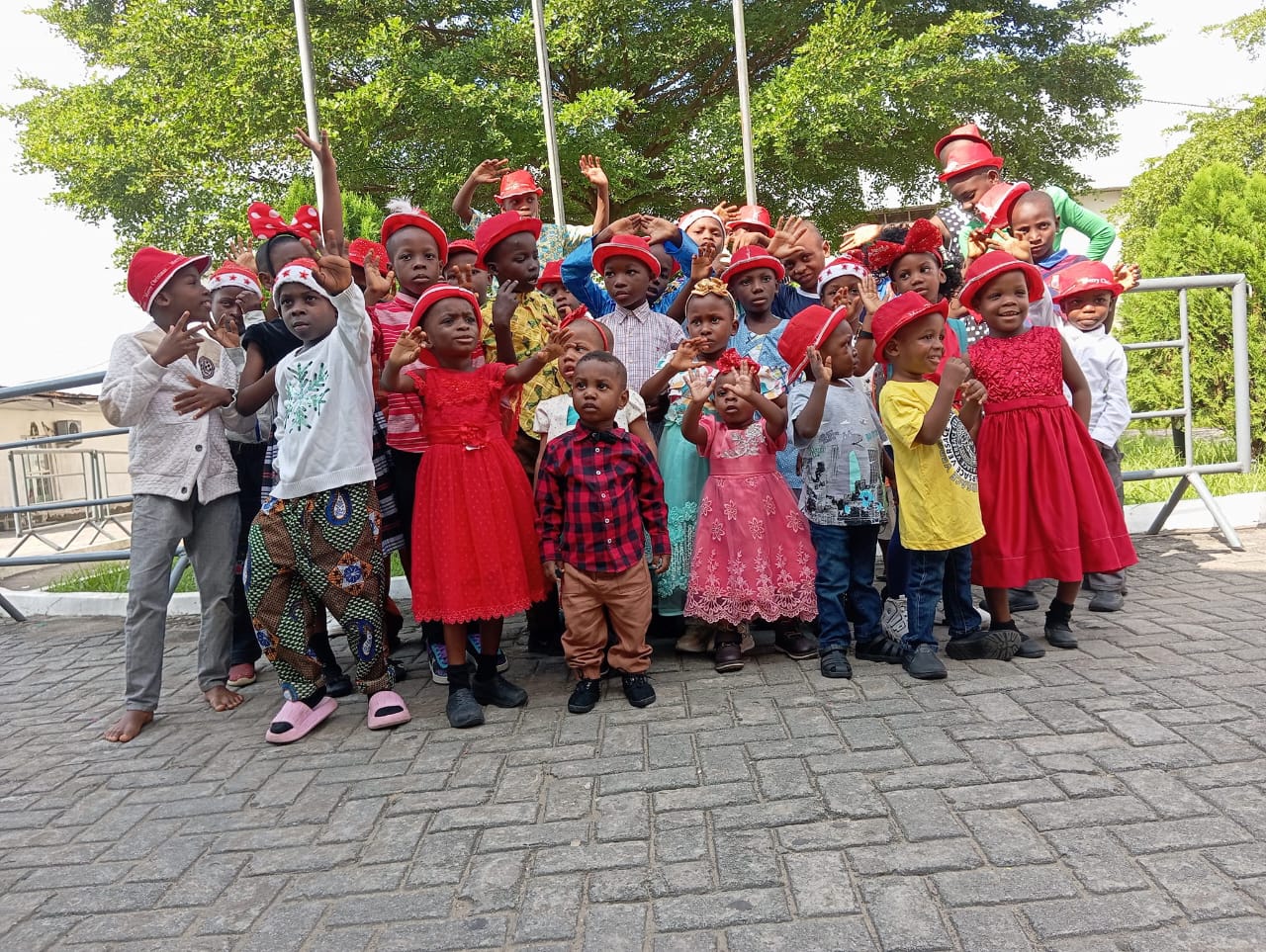 Children in school uniform outside the home in Calabar